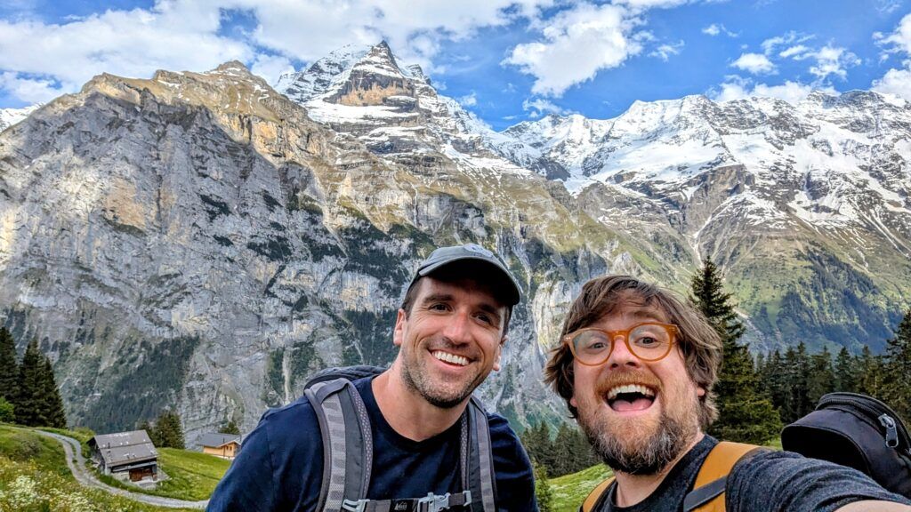Ian and Brad posing against a backdrop of the Swiss alps
