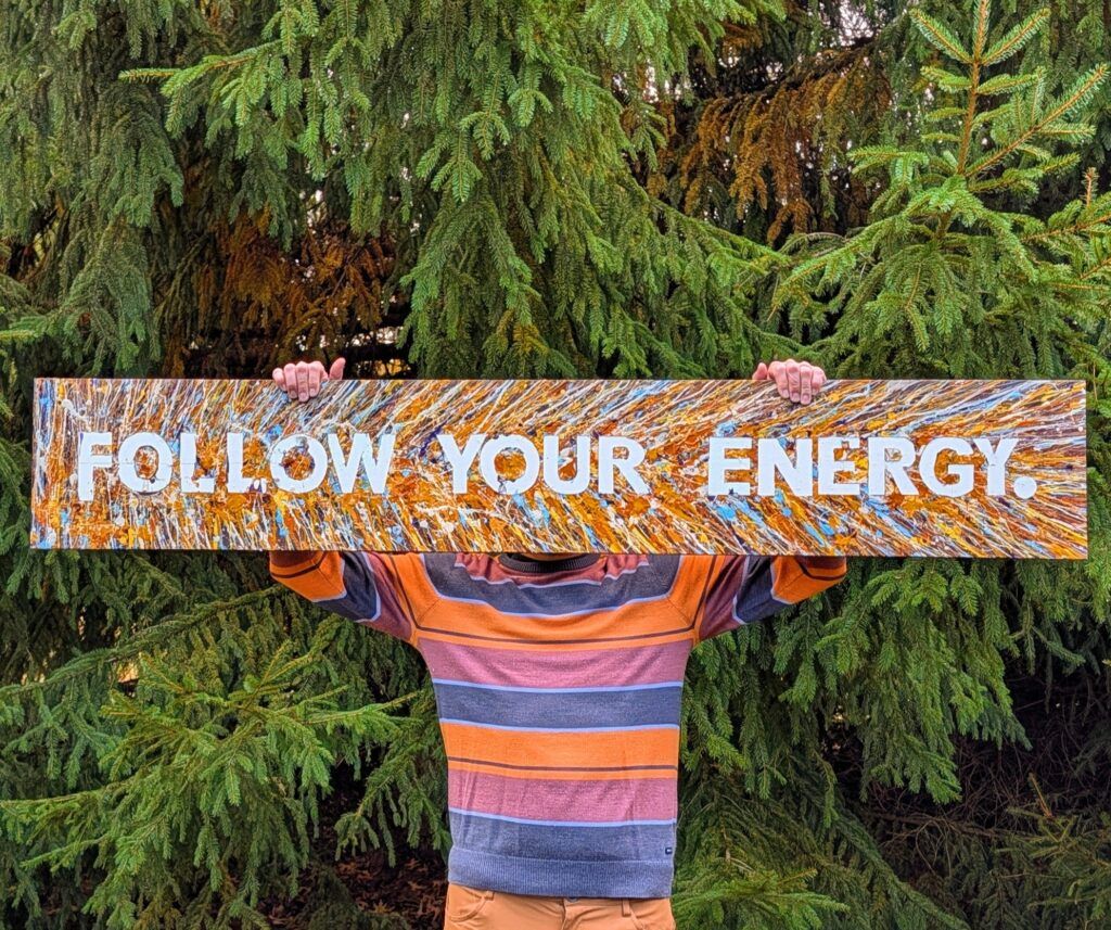 Brad holding his art piece 