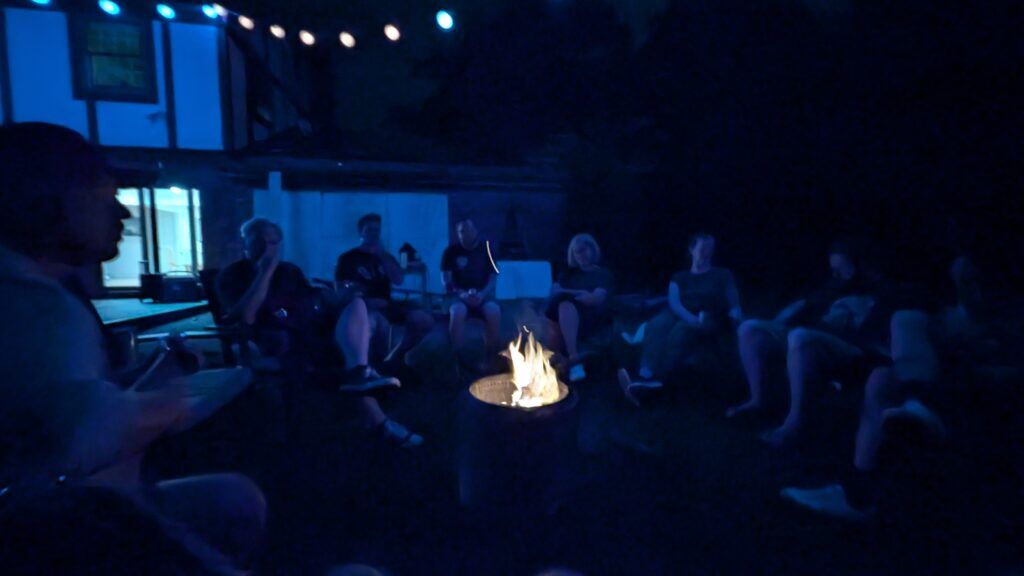 A bunch of Frostapalooza musicians sitting around a camp fire