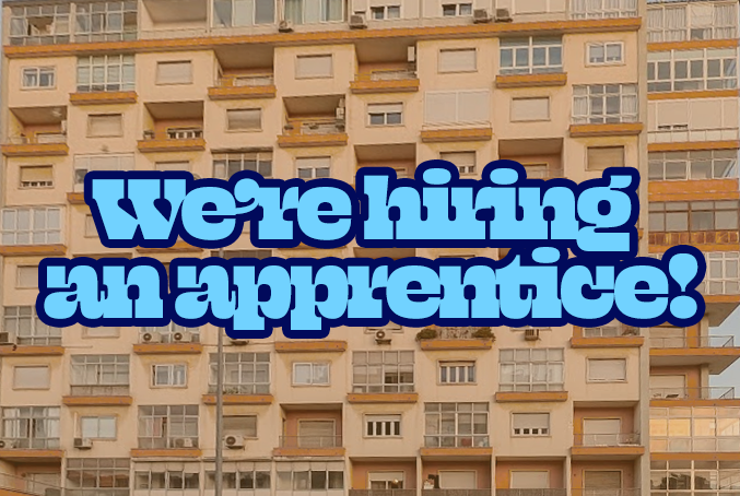 We're hiring an apprentice with an image of apartment buildings in the background